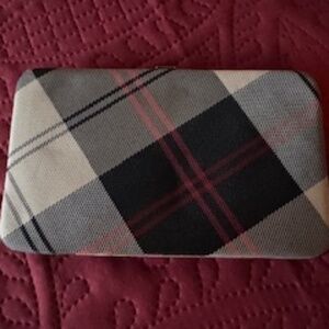 small purse, beautiful print, never used, clasp to close